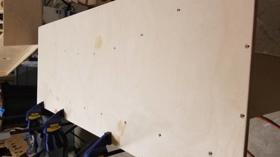 Top, holes countersunk and drilled. French cleat on the trailing edge. I think I put 29 screws to hold it down?