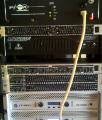 Voltage Regulator at top of pic. Note the yellow lamp below the green. This indicates a dip in input voltage. FYI this is during a bass hit with the system running BELOW war volume. The input circuit is a heavy duty 25A circuit. This illustrates the instability of your supply voltage.