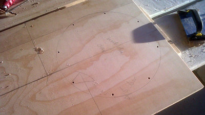 Wait until you have the driver before going past panel 3. You need it for a 360 degree all around satisfactory fit. We Drill the t nut holes with the diver centered on the driver cutout then returned it back for break in. Per BillF place drive hole “off axis”