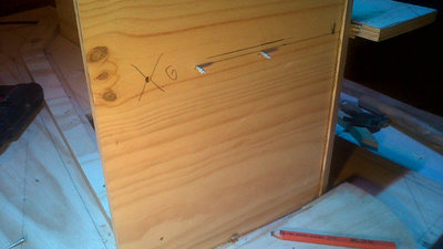 Panel 2 brace holes and a marked guide hole with a G. Brace can’t go in until after the driver panel is installed.