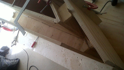 Checking the horn path measurements on the open end of panel 8 in a dry test fit.