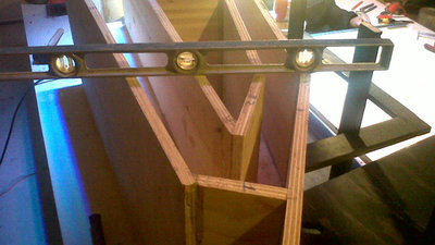 Sanding the panels more or less flat so the PL squeezes out uniformly.