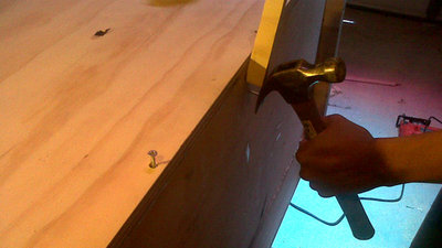 Using a screw to true panel 12 to the cap panel.