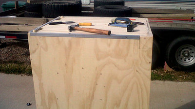 I choose to put the corners rails and corner brackets on before I Stain the wood to prevent the “unforeseen” slip of a hammer or sanding that could scratch the stain. I carefully mark the space for the Corner wheels. The Corner brackets are from reliable hardware as is the corner wheels.  The corner rails are actually corner wall protectors from Lowes.