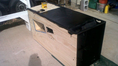 I removed the Driver access door because during testing there appeared to be a leak coming from inside the Speakon cable plug. Here I’m staining with the grain with minwax ebony wood finish. Initially we wanted to carpet the tuba or spray with duratex but settled on black wood finish with four coats of interior polyurethane.
