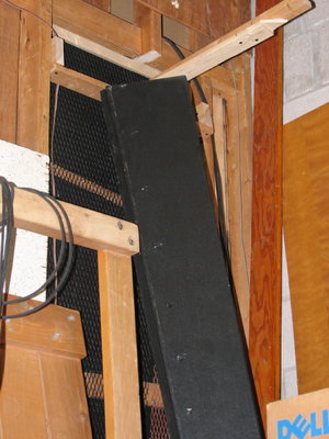 The TLAH behind the grille. A strap is screwed onto the top, which in turn is screwed to another strap in order to locate the tilt. Quick-clamps helped do the job for initial setting of the angle