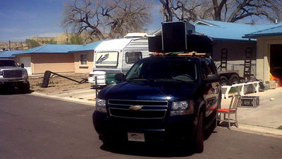Tri-pod cradle holding up the weight of the JBLs and a tuba