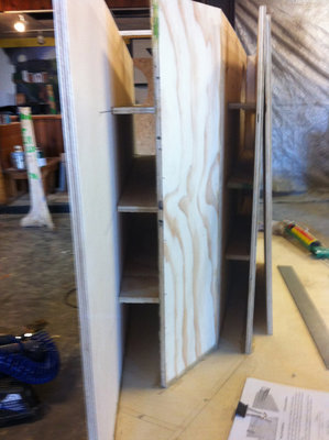 A view of the braces. No the board is not crooked, the other board leaning against it just makes it look that way.