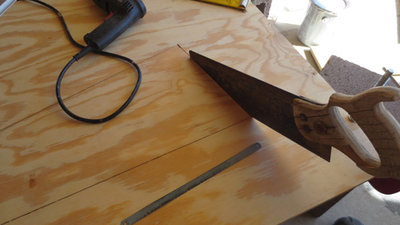 using the corners drilled with 1/16th drill bit to start off with until it's wide enough for the saws.