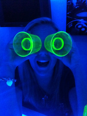 The Blue LED's give the same effect as a blacklight.  This is my fiance holding up shot glasses.