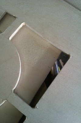 I cut out the baffles, and all parts in fact, one on top of the other, using a jigsaw.  Should have left the drilled corners back a bit.